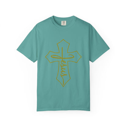 Teal t-shirt with a gold cross and 'Jesus' on a white background