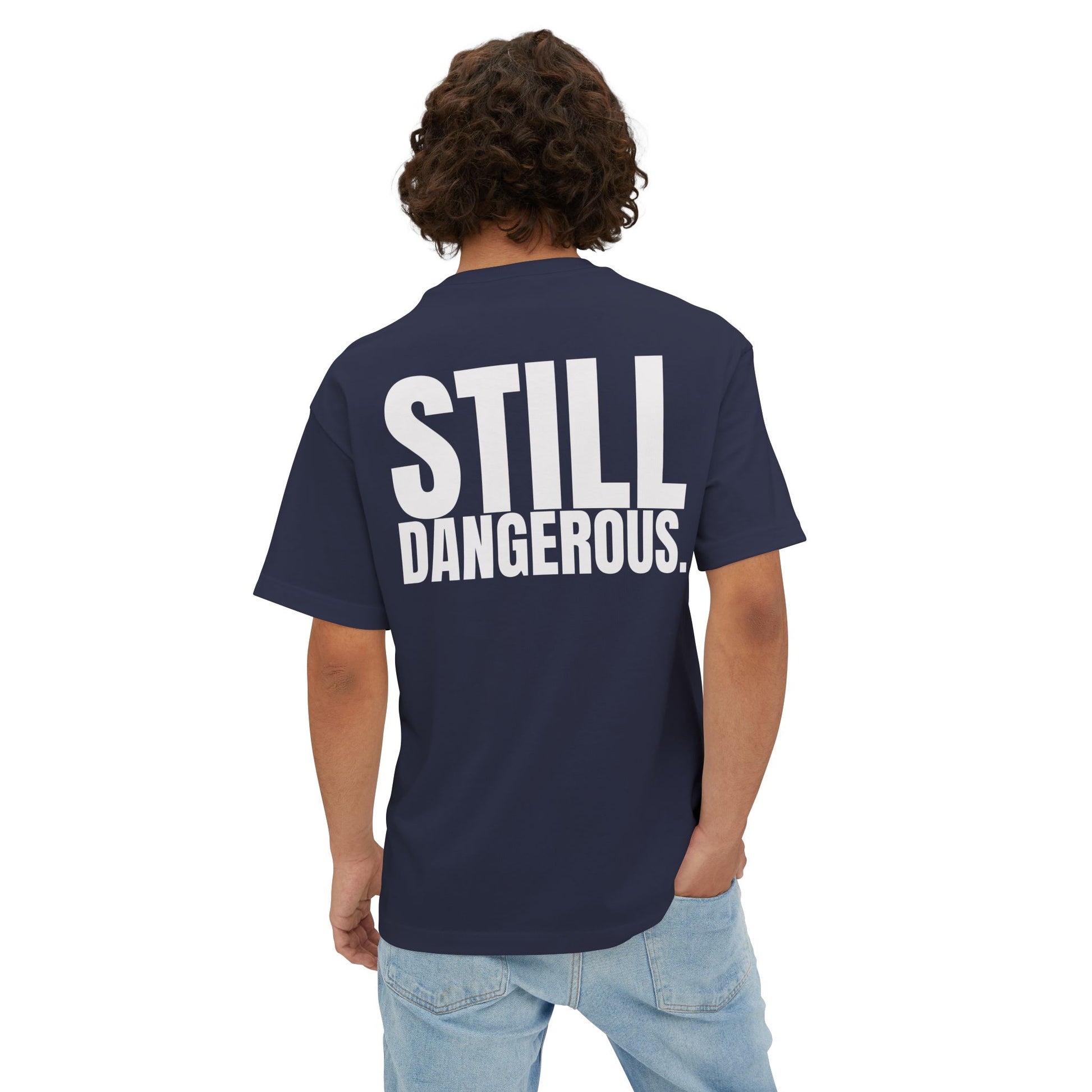 Close-up of Forgiven Still Dangerous Christian streetwear tee in black showing high-neck Forgiven text placement.