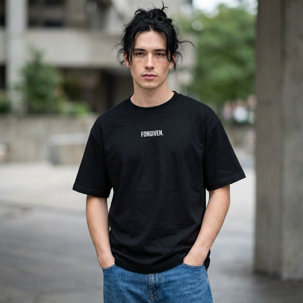 Close-up of Forgiven Still Dangerous Christian streetwear tee in black showing high-neck Forgiven text placement.