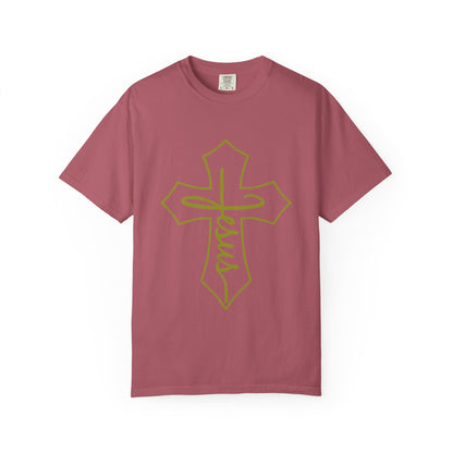 Pink t-shirt with a yellow cross design on a white background