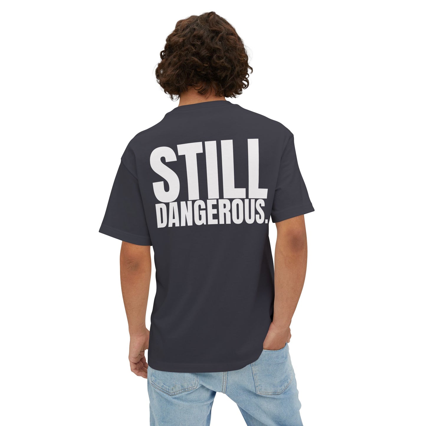 Close-up of Forgiven Still Dangerous Christian streetwear tee in black showing high-neck Forgiven text placement.