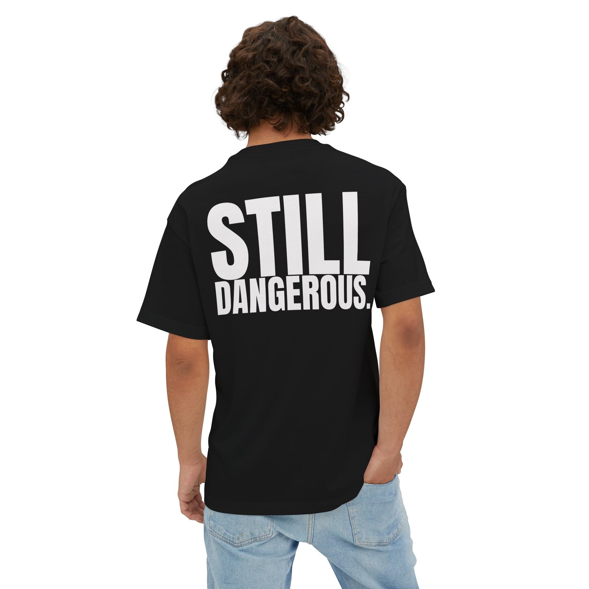 Close-up of Forgiven Still Dangerous Christian streetwear tee in black showing high-neck Forgiven text placement.